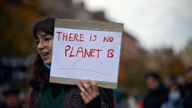 During the climate rally in Toulouse, France in 2021, a young woman held up a sign saying 'No alternative planet'.