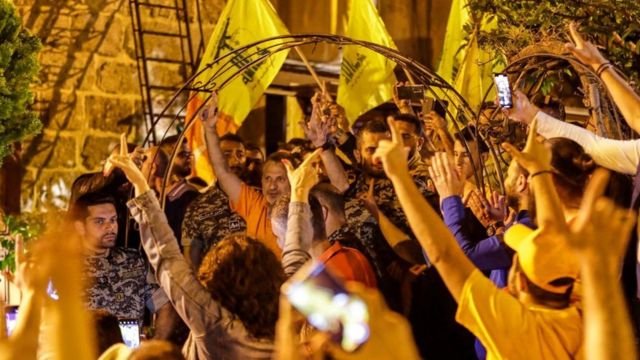 Zebran Basil, a former Lebanese foreign minister and parliamentarian, waved Hezbollah flags at his home in Badrun and met with supporters.