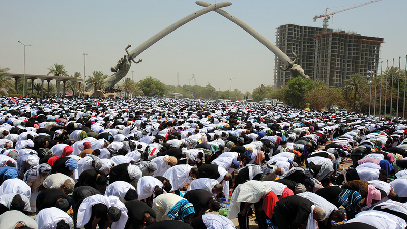 Sadr supporters perform Friday prayers in the Green Zone