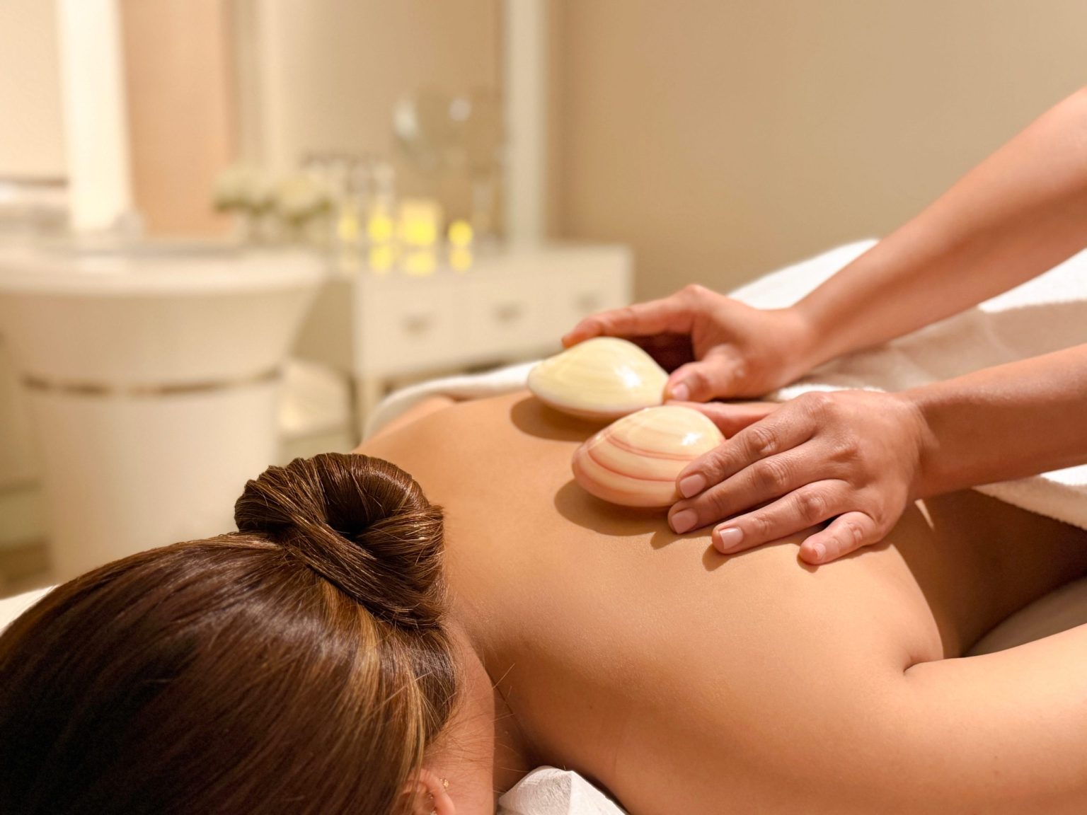 Polished Tiger Clam Shells Replace Hot Stones at Paramount Midtown Spa
