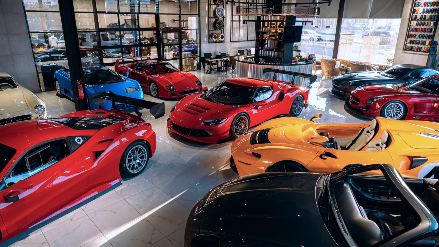 The world’s lowest-mileage Bugatti EB110 GT. An unrestored 1955 Mercedes-Benz 300 SL Gullwing in its original paint and interior. Inside DEIZ Motors. The DEIZ Motors floor in Dubai. The 1994 Bugatti EB110 GT, in blue, has covered approximately 685 kilometres from new.