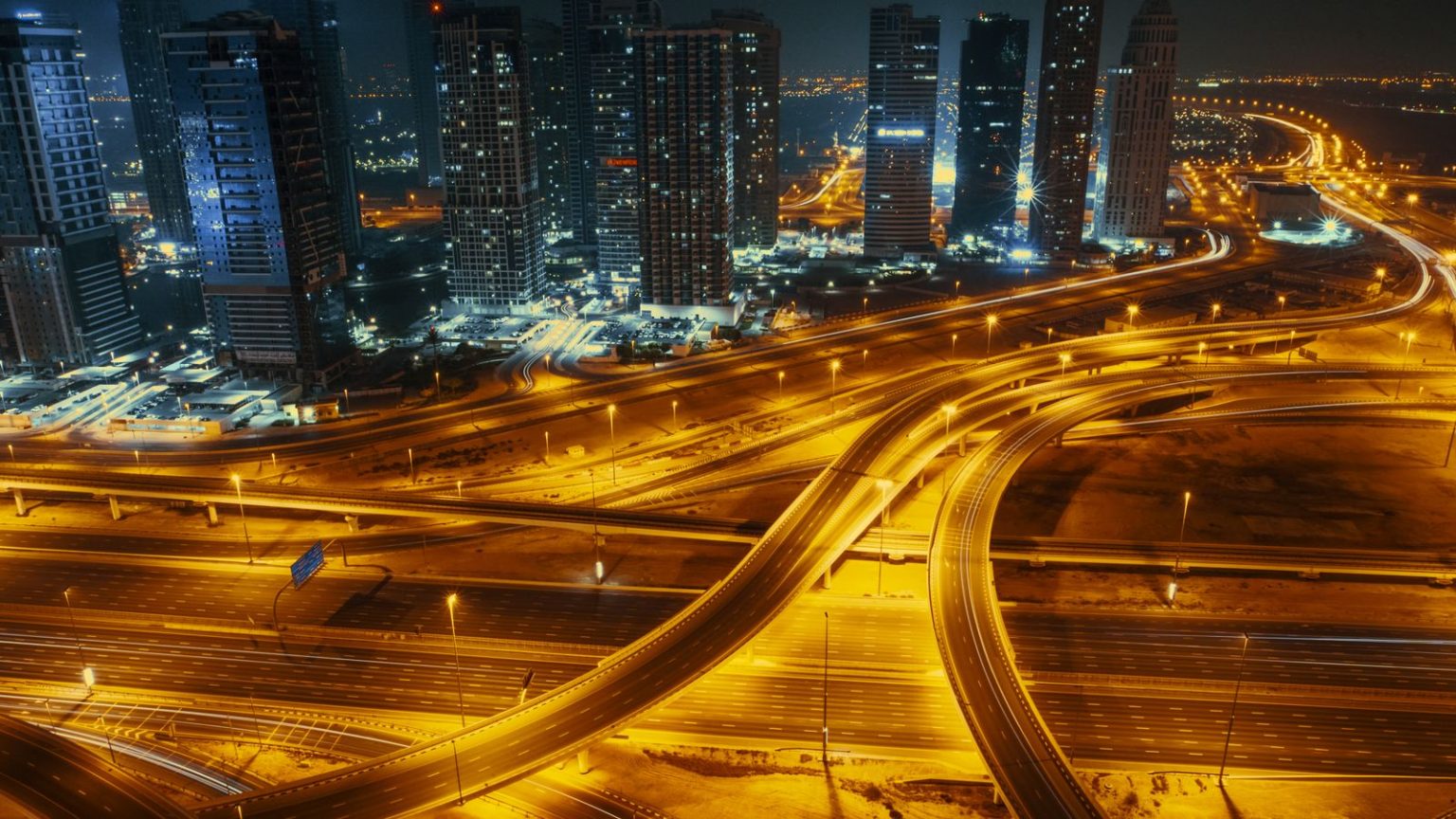 Dubai highways and skyscrapers at night